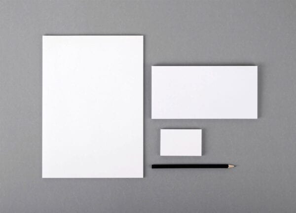 Three different sizes of pad paper and a pencil