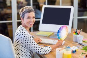 A woman holding a color wheel