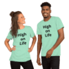 A man and woman wearing a light green high on life shirt