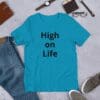 A blue t-shirt that says high on life.