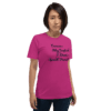 A woman wearing a pink t-shirt with the words " because my godfather is special enough ".