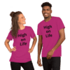 A man and woman wearing pink shirts with the words " high on life ".