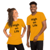 A man and woman wearing yellow shirts with the words " high on life ".