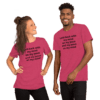 A man and woman wearing pink shirts with black lettering.
