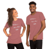 A man and woman wearing pink shirts with words on them.