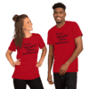 A man and woman wearing red shirts with black writing.