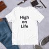 A white t-shirt that says high on life.
