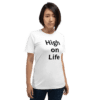A woman wearing a white t-shirt with the words " high on life ".