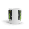 A coffee mug with an alien on it.