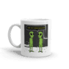 A coffee mug with an alien picture on it.