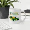 A coffee mug with the jamaican flag on it.