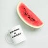 A watermelon and coffee mug with the words " in my mammaw or in my caffee ?" on it.