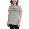 A woman wearing a t-shirt with the words are we human ? or are we smartphone ? written on it.