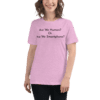 A woman wearing a pink shirt with the words are we human or just me smartphone