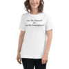A woman wearing a white t-shirt with the words are we human ? or, do we smartphone ? written on it.
