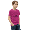 A boy wearing jeans and a t-shirt with the words " i just blazed out ".