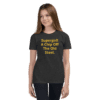 A girl wearing black jeans and a t-shirt.