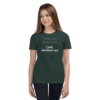 A girl wearing dark green shirt with text on it.