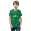 A boy wearing a green shirt with the words " i just blocked out ".