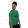 A person standing in front of a green background