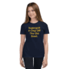 A girl wearing black jeans and a navy blue t-shirt.