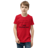 A boy wearing a red shirt and jeans.