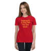 A girl wearing a red shirt with the words supergrit, a chip off the old street.