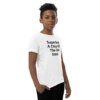 A young person wearing a t-shirt with the words " superior a child of the old soul ".