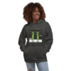 A woman wearing a hoodie with an image of two green people.