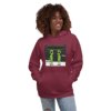 A woman wearing a hoodie with an image of two green people.