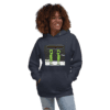 A woman wearing a hoodie with an image of two green people.