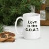 white-glossy-mug-15oz-christmas-61871b69a44b4 A white coffee mug sitting on top of a table.