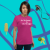 unisex-staple-t-shirt-berry-front-628f1d089337 A woman standing in front of a wall with headphones and an ice cream.
