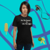 unisex-staple-t-shirt-black-front-628f1d088dd9 A woman standing in front of a blue wall.