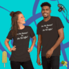 unisex-staple-t-shirt-brown-front-628f18b70469 A man and woman posing for the camera wearing black shirts.