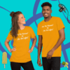 unisex-staple-t-shirt-gold-front-628f18b6cf2ed A man and woman posing for the camera wearing yellow shirts.
