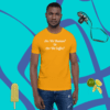 unisex-staple-t-shirt-gold-front-628f1c0086bd0 A man wearing an orange shirt with some fruit