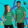 unisex-staple-t-shirt-kelly-front-628f18b6e133 A man and woman posing for the camera wearing green shirts.