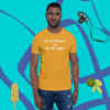 unisex-staple-t-shirt-mustard-front-628f1c008a A man wearing an orange shirt with some fruit