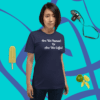 unisex-staple-t-shirt-navy-front-628f1d0896b46 A woman standing in front of a blue wall.