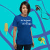 unisex-staple-t-shirt-true-royal-front-628f1d0 A woman standing in front of a blue wall.