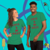 A man and woman wearing green shirts with the words " love is in the grass ".