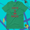 A green shirt that says love is the goat.