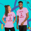 A man and woman posing for the camera wearing t-shirts.