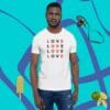 A man wearing jeans and a t-shirt with the word love on it.