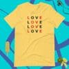 A yellow t-shirt that says love in different languages.