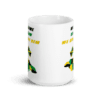 A white mug with a picture of a person on it.