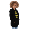 A young child wearing a black hoodie.