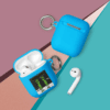 A blue case next to an apple airpod.