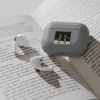 A book with an alarm clock on it